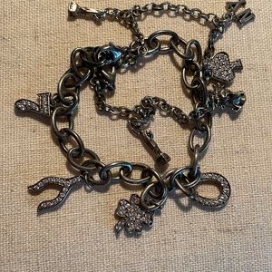 Lucky Brand bracelet with dimel acccents and claw closure burnish silver color